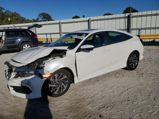 HONDA CIVIC EX 2018 with VIN 19XFC2F77JE002161 - Photo from auction