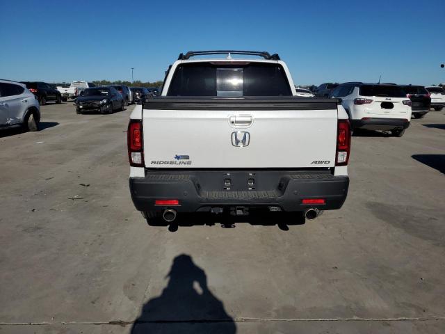 Photo 6 from auction – 2023 HONDA RIDGELINE with VIN 5FPYK3F71PB031909