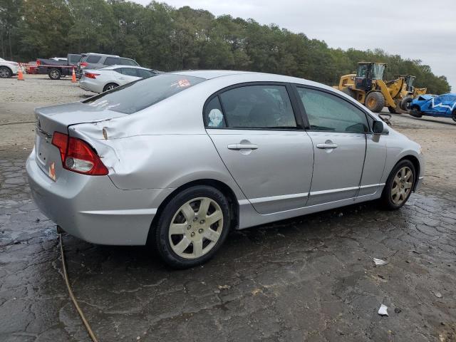 Photo 3 from auction – 2011 HONDA CIVIC LX with VIN 19XFA1F59BE035548