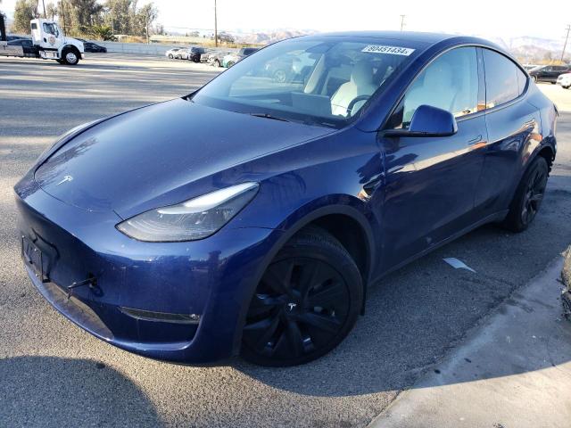 TESLA MODEL Y 2023 with VIN 7SAYGAEE7PF662911 - Photo from auction