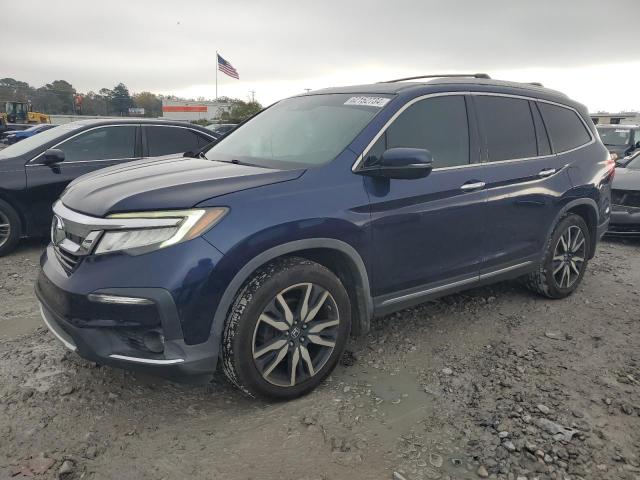 HONDA PILOT TOUR 2019 with VIN 5FNYF5H66KB013959 - Photo from auction