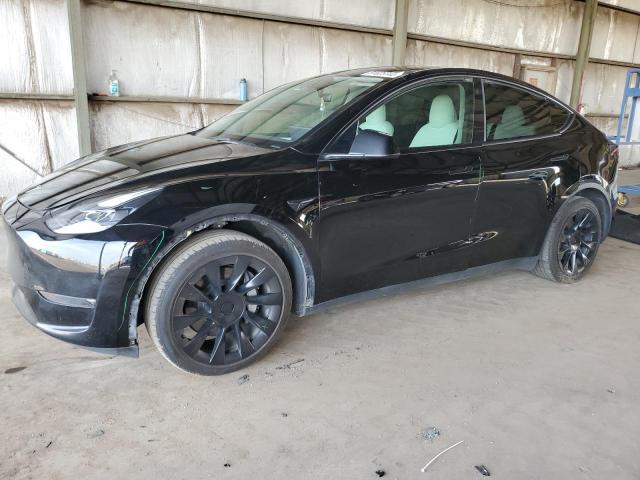 TESLA MODEL Y 2023 with VIN 7SAYGAEE8PF644661 - Photo from auction