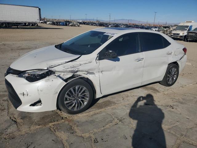 TOYOTA COROLLA L 2017 with VIN 5YFBURHE4HP572711 - Photo from auction