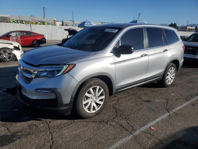 HONDA PILOT LX 2020 with VIN 5FNYF5H17LB018562 - Photo from auction
