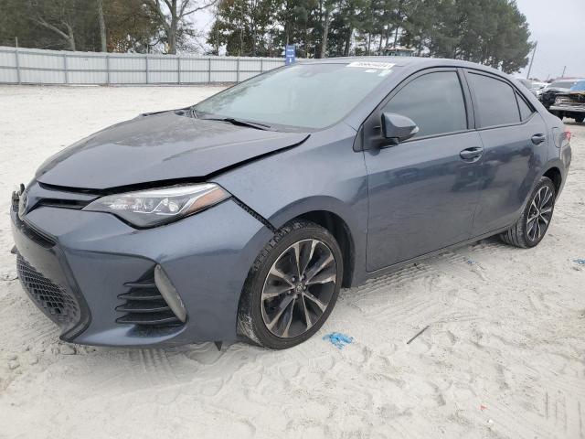 TOYOTA COROLLA L 2018 with VIN 5YFBURHE5JP824052 - Photo from auction