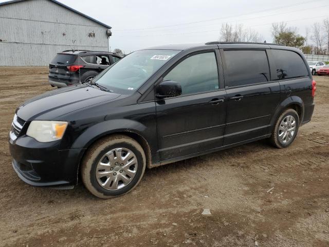 DODGE GRAND CARA 2014 con VIN 2C4RDGEG0ER129704 - Foto de la subasta