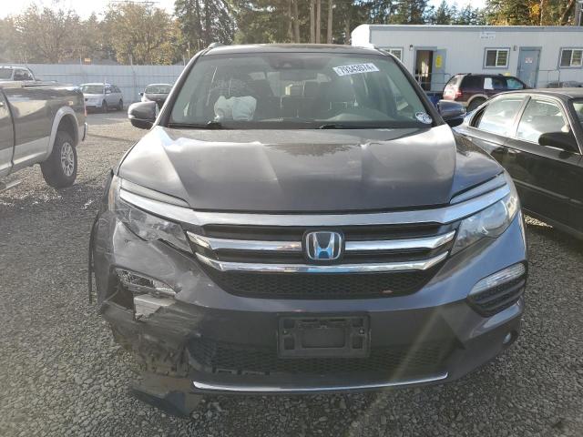 Photo 5 from auction – 2018 HONDA PILOT ELIT with VIN 5FNYF6H06JB049585