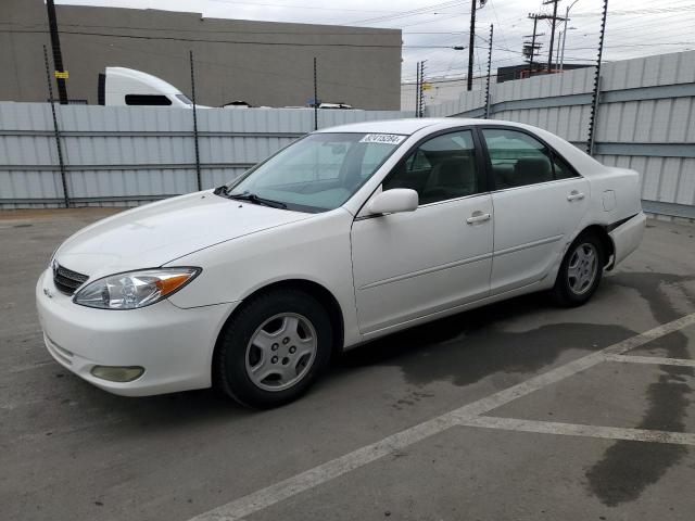 TOYOTA CAMRY LE 2002 with VIN 4T1BF30K42U005929 - Photo from auction