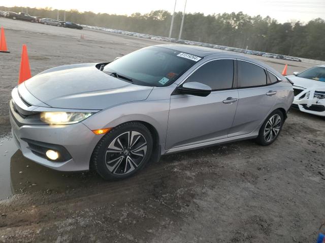 HONDA CIVIC EXL 2017 with VIN 2HGFC1F79HH632127 - Photo from auction