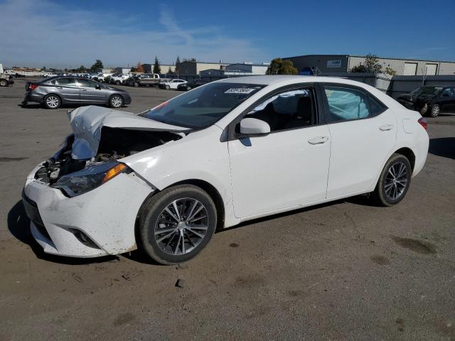 TOYOTA COROLLA L 2016 with VIN 5YFBURHE9GP521218 - Photo from auction
