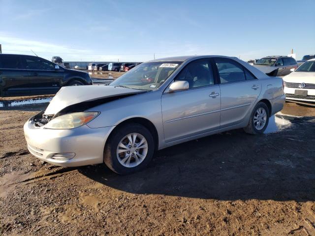 TOYOTA CAMRY LE 2004 with VIN 4T1BF32K44U572786 - Photo from auction