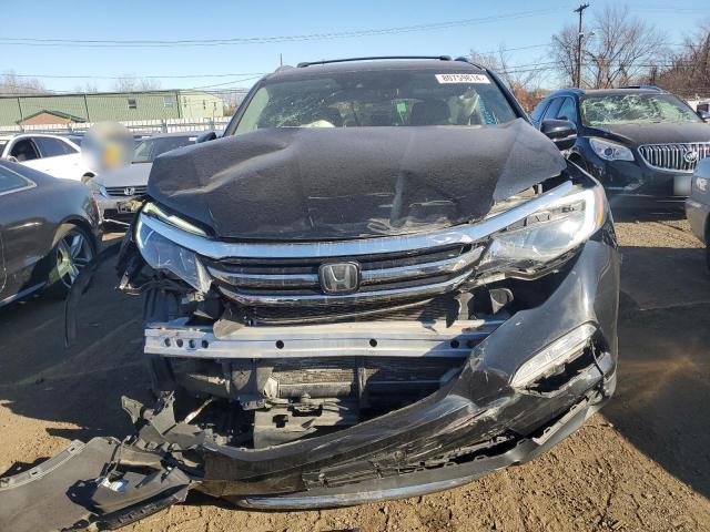 Photo 5 from auction – 2018 HONDA PILOT ELIT with VIN 5FNYF6H04JB032946