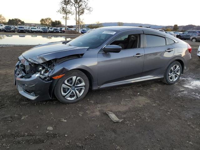 HONDA CIVIC LX 2018 with VIN 2HGFC2F53JH568208 - Photo from auction