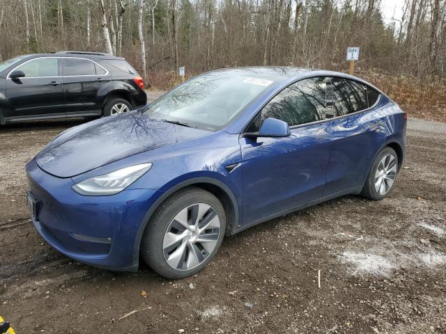 TESLA MODEL Y 2021 with VIN 5YJYGAEEXMF136863 - Photo from auction