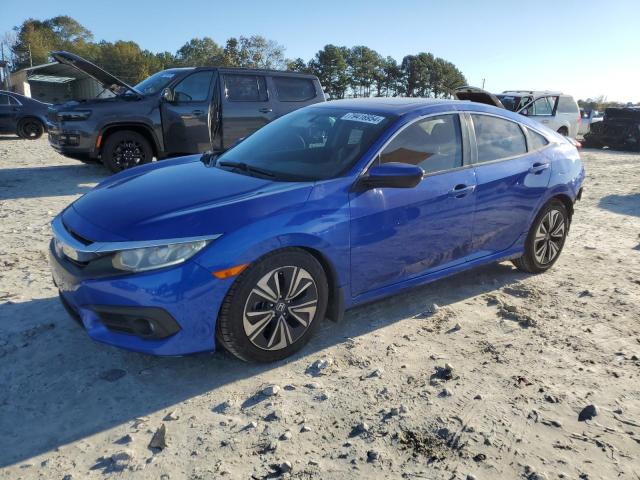HONDA CIVIC EX 2017 with VIN 19XFC1F32HE005079 - Photo from auction