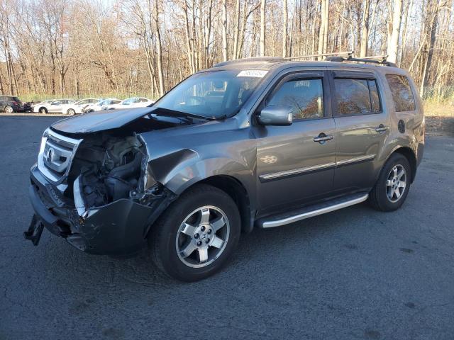HONDA PILOT TOUR 2011 with VIN 5FNYF4H94BB053073 - Photo from auction
