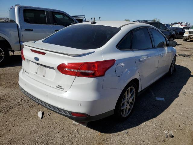 Снимка 3 от търг – 2015 FORD FOCUS SE с VIN 1FADP3F23FL380441