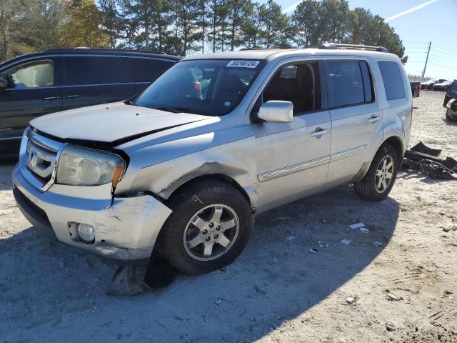 HONDA PILOT TOUR 2010 with VIN 5FNYF3H84AB002687 - Photo from auction