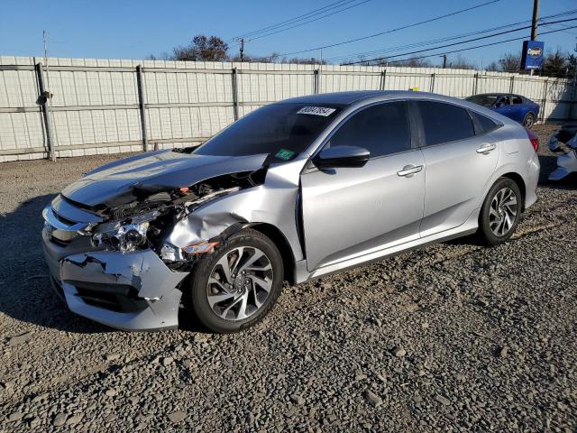 HONDA CIVIC EX 2018 with VIN 19XFC2F77JE023009 - Photo from auction