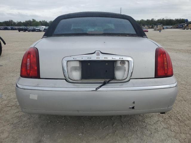 Photo 6 from auction – 2002 LINCOLN TOWN CAR E with VIN 1LNHM81W82Y671926