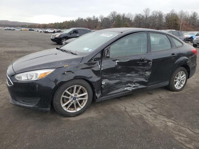 FORD FOCUS SE 2018 with VIN 1FADP3F21JL306959 - Photo from auction