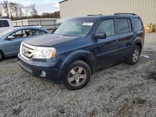 HONDA PILOT EXLN 2011 with VIN 5FNYF3H74BB013584 - Photo from auction