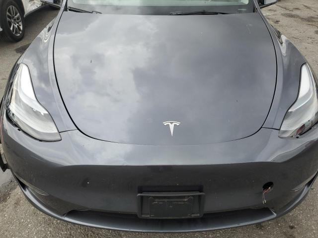 Photo 12 from auction – 2023 TESLA MODEL Y with VIN 7SAYGDEE0PF695329