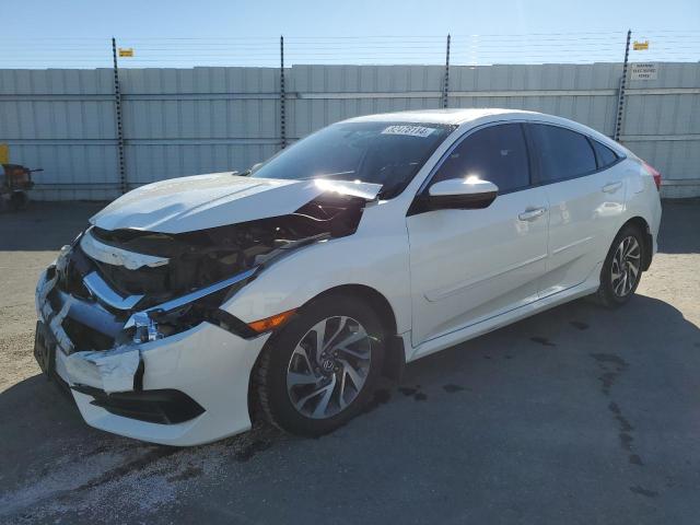 HONDA CIVIC EX 2018 with VIN 19XFC2F77JE202697 - Photo from auction