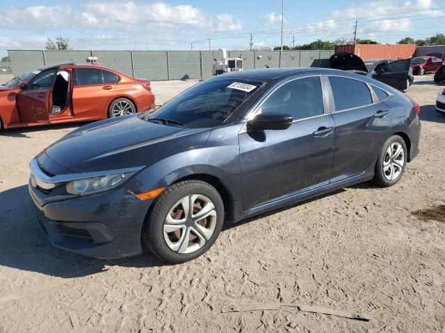 HONDA CIVIC LX 2018 with VIN 19XFC2F58JE009361 - Photo from auction