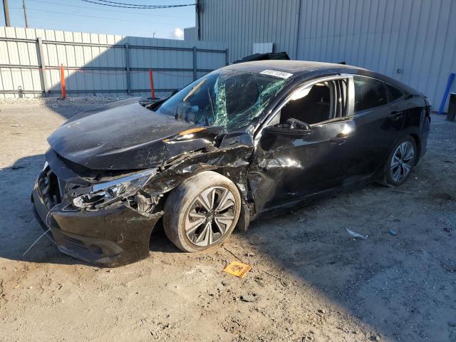 HONDA CIVIC EX 2017 with VIN 2HGFC1F3XHH630433 - Photo from auction