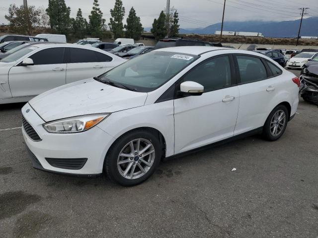 FORD FOCUS SE 2017 with VIN 1FADP3F21HL304476 - Photo from auction