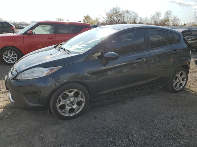 FORD FIESTA SE 2011 with VIN 3FADP4EJ3BM185060 - Photo from auction
