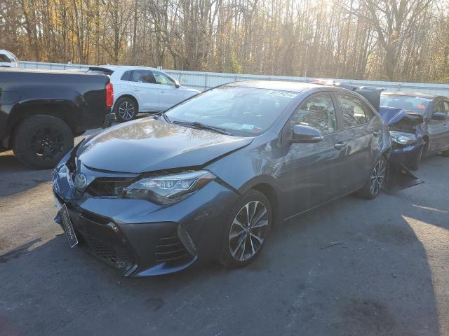 TOYOTA COROLLA L 2018 with VIN 5YFBURHE6JP804697 - Photo from auction