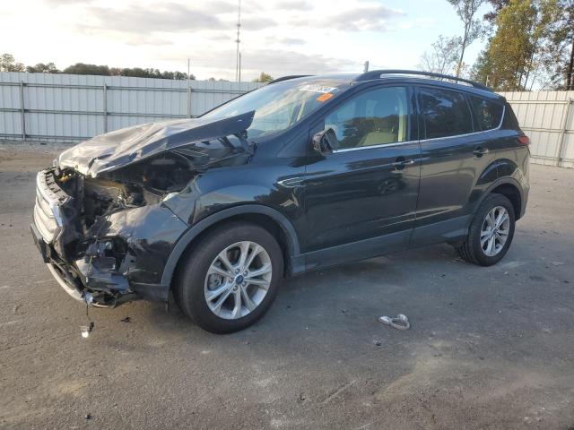FORD ESCAPE SE 2018 with VIN 1FMCU9GD1JUC57852 - Photo from auction