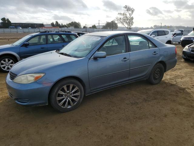 TOYOTA CAMRY LE 2003 with VIN JTDBE32KX30233091 - Photo from auction