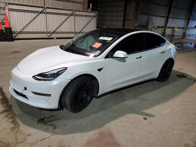 TESLA MODEL 3 2021 with VIN 5YJ3E1EA3MF062831 - Photo from auction