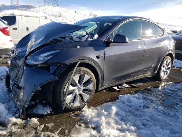 TESLA MODEL Y 2023 with VIN 7SAYGAEE1PF584643 - Photo from auction
