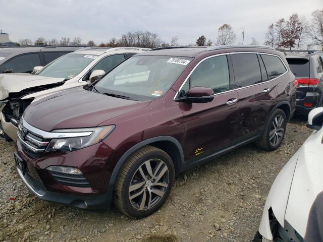 HONDA PILOT TOUR 2017 with VIN 5FNYF6H96HB077590 - Photo from auction
