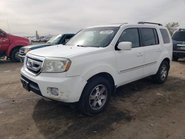 HONDA PILOT TOUR 2010 with VIN 5FNYF4H92AB012374 - Photo from auction
