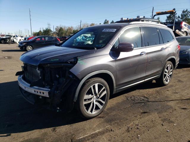 HONDA PILOT TOUR 2017 with VIN 5FNYF6H98HB068115 - Photo from auction