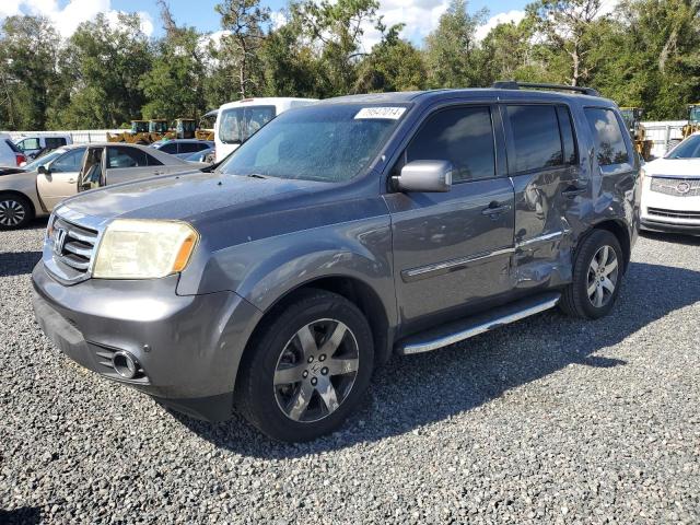 HONDA PILOT TOUR 2014 with VIN 5FNYF3H98EB012637 - Photo from auction