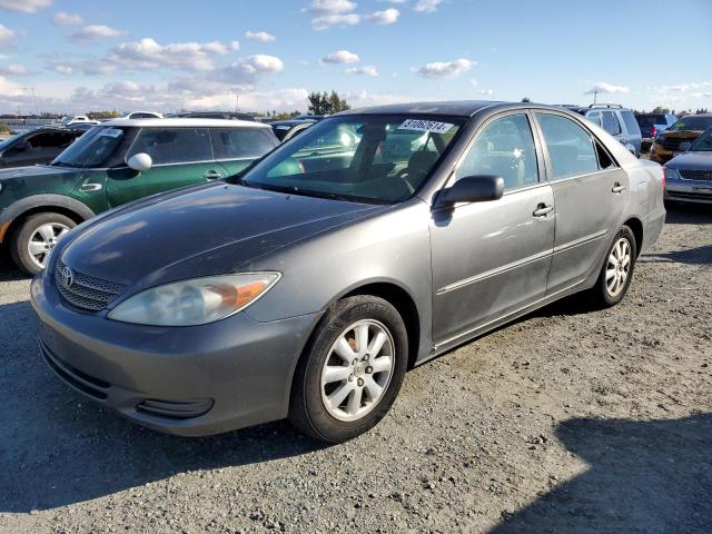 TOYOTA CAMRY LE 2002 with VIN JTDBF30K520003957 - Photo from auction