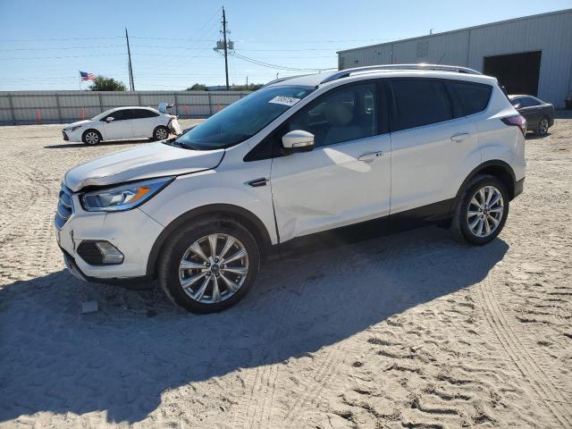 FORD ESCAPE TIT 2017 with VIN 1FMCU0J91HUD59923 - Photo from auction