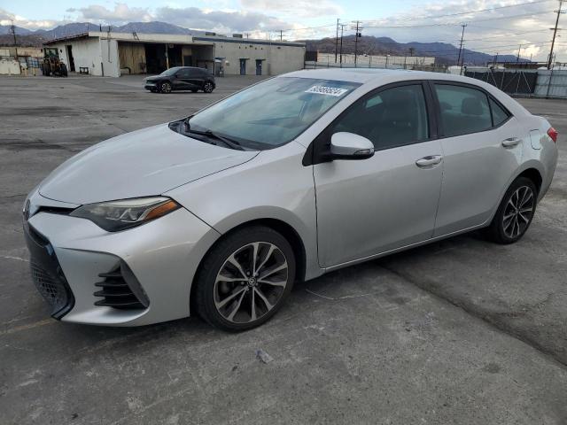 TOYOTA COROLLA L 2017 with VIN 2T1BURHE1HC765768 - Photo from auction