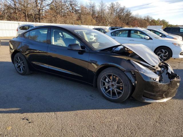 Photo 4 from auction – 2022 TESLA MODEL 3 with VIN 5YJ3E1EAXNF352582