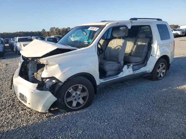 HONDA PILOT TOUR 2011 with VIN 5FNYF4H99BB010882 - Photo from auction