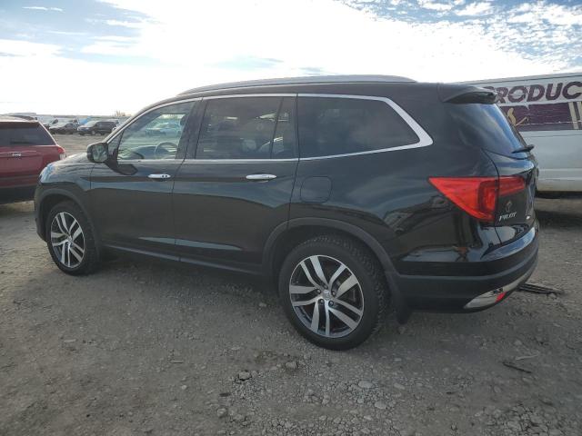Photo 2 from auction – 2017 HONDA PILOT TOUR with VIN 5FNYF6H98HB096299