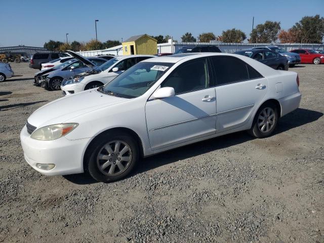 TOYOTA CAMRY LE 2003 with VIN 4T1BF30K13U036394 - Photo from auction