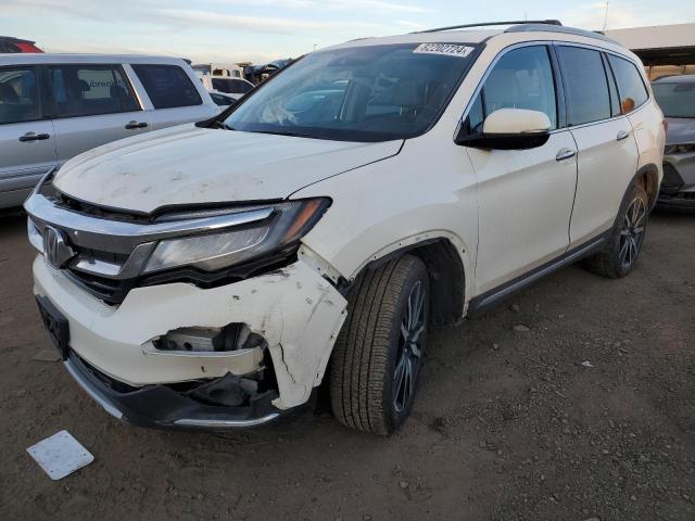 HONDA PILOT TOUR 2019 with VIN 5FNYF6H69KB081792 - Photo from auction