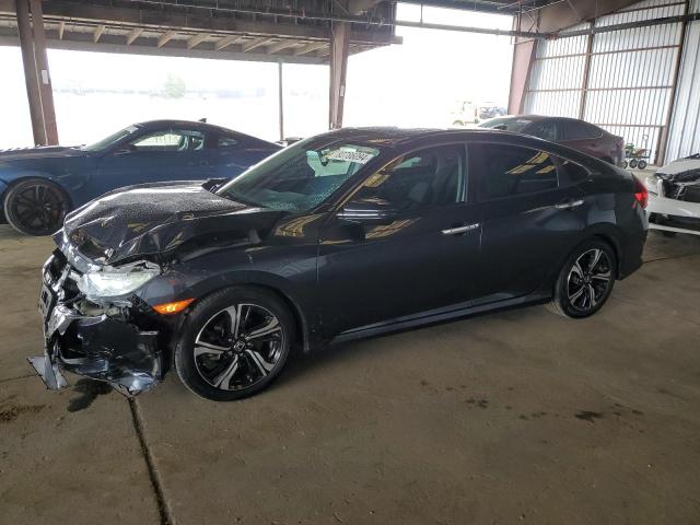 HONDA CIVIC TOUR 2017 with VIN 19XFC1F99HE214680 - Photo from auction